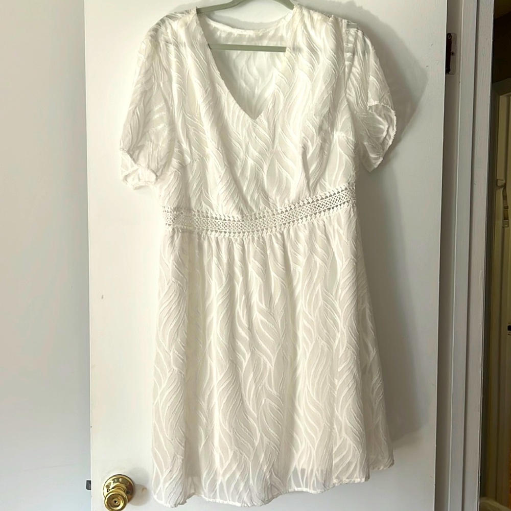 White dress with lace detail. Bridal outfit
